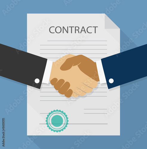 Businessman handshake on contract paper after agreement