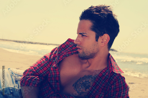 sexy male on the beach