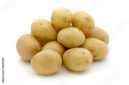 Potatoes on the white background.  New harvest.