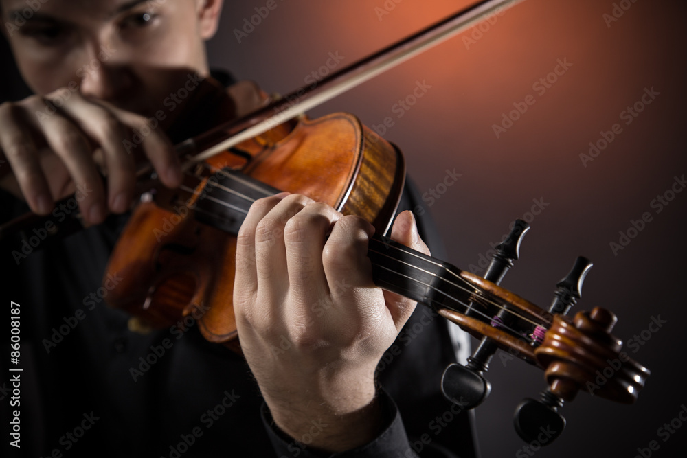 Fototapeta premium Young man with violin
