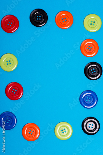 a lot of colorful buttons on a blue background
