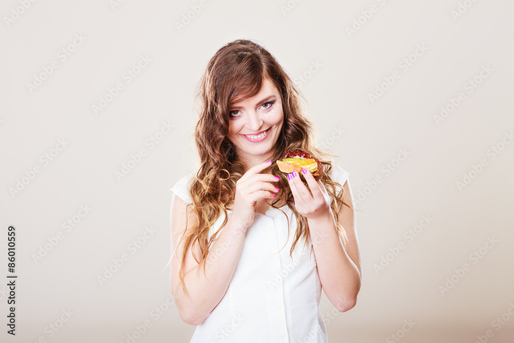cute woman holds fruit cake in hand cute woman holds fruit cake in hand