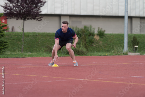 Athlete Running To The Cone