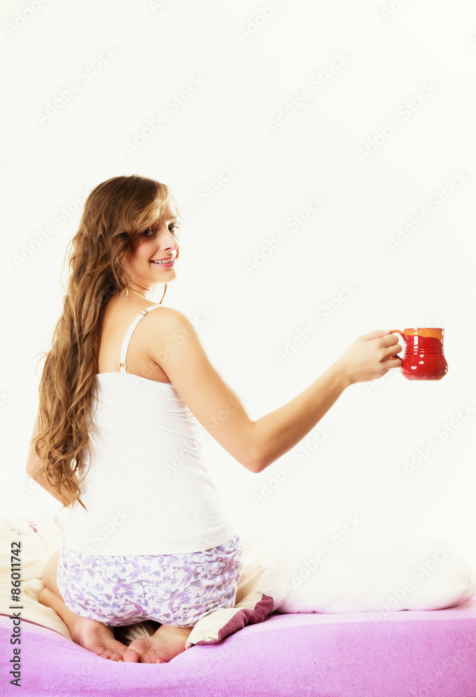 Girl relaxing on bed at morning with tea cup Girl relaxing on bed at morning with tea cup
