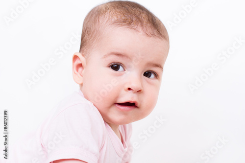 Close-up portrait of a beautiful baby on white background