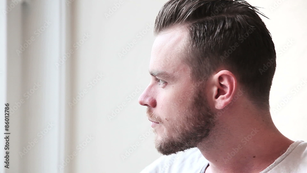 Man enjoying a cup of coffee indoors wearing a tshirt