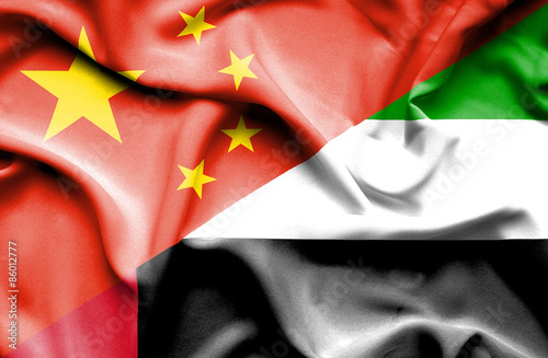 Waving flag of United Arab Emirates and China