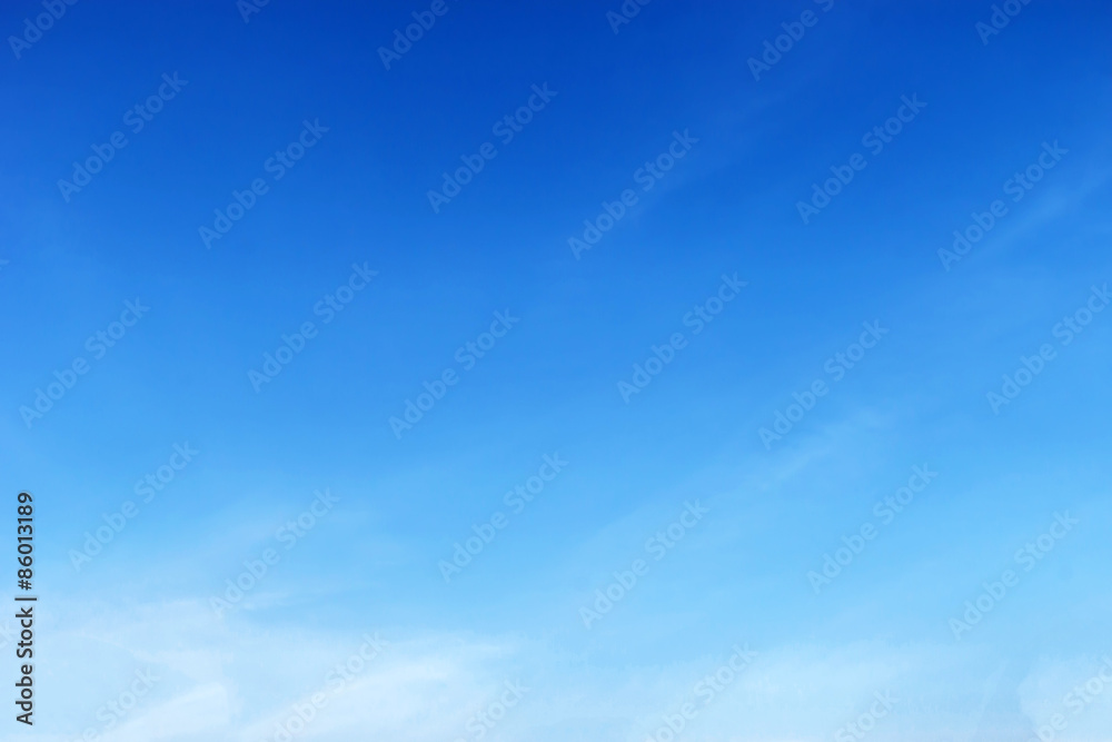 Fantastic soft white clouds against blue sky .