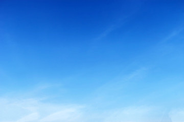 Fantastic soft white clouds against blue sky .
