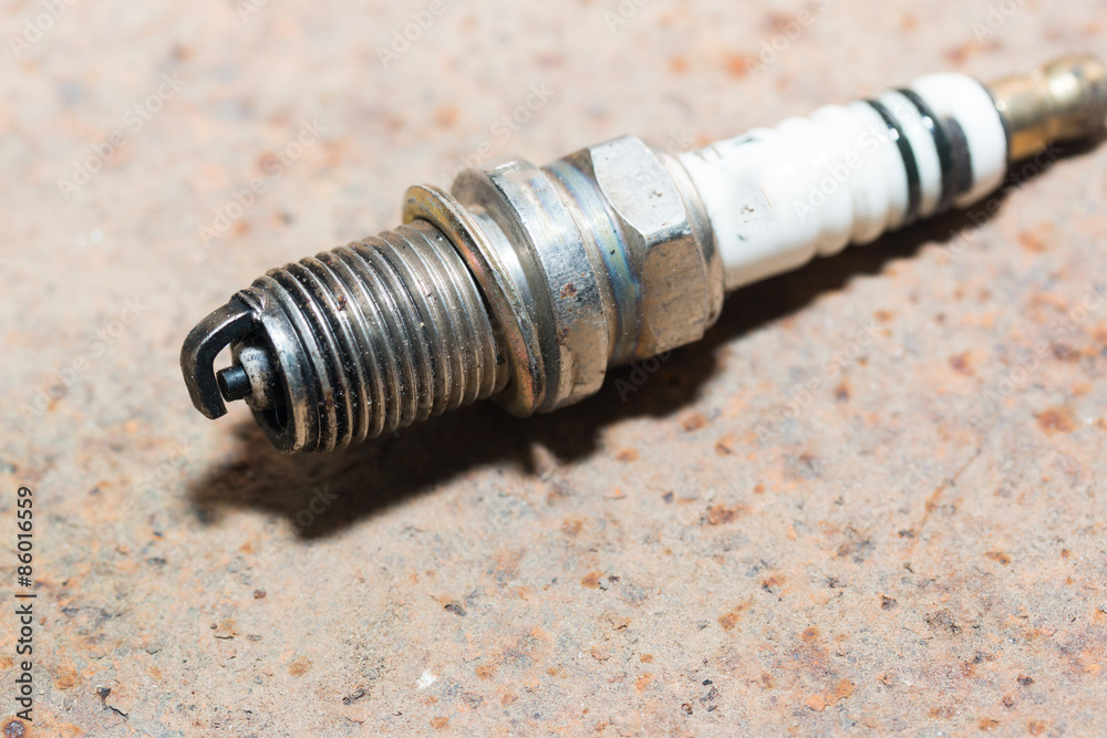 Used and new sparkplug, isolated Rusty iron background
Used and new sparkplug, isolated Rusty iron background