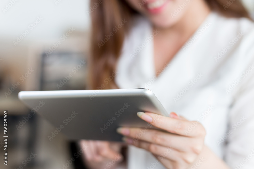 Asian beautiful female student study with tablet in classroom Asian beautiful female student study with tablet in classroom