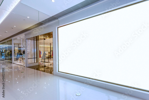 Empty blank billboard in shopping mall interior