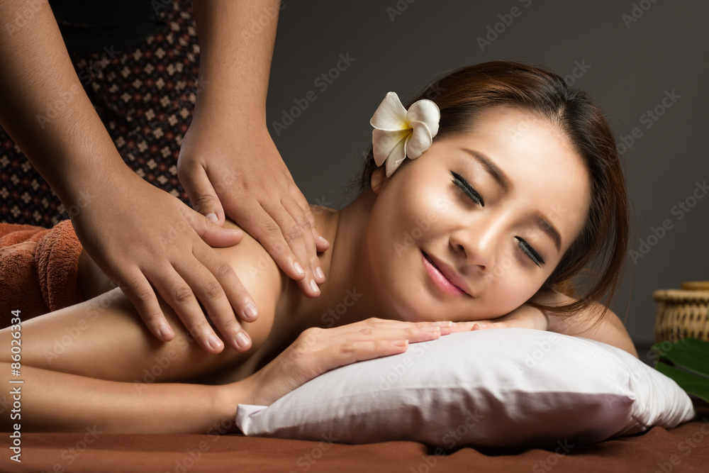 Asian Girl Relaxing Having Arm Massage in a Spa Salon, Close Up