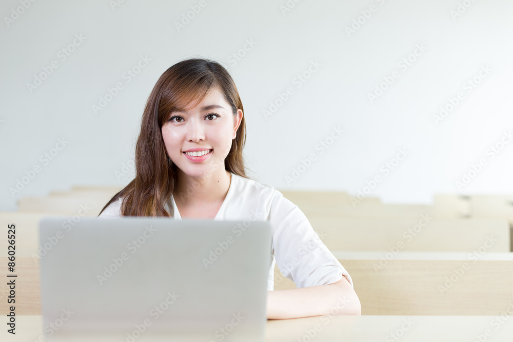Asian beautiful female student study with laptop in classroom Asian beautiful female student study with laptop in classroom
