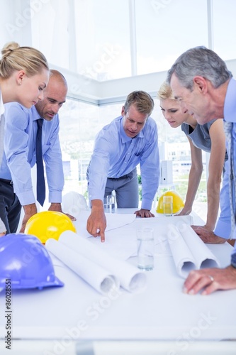Team of business people looking at construction plan  © WavebreakMediaMicro