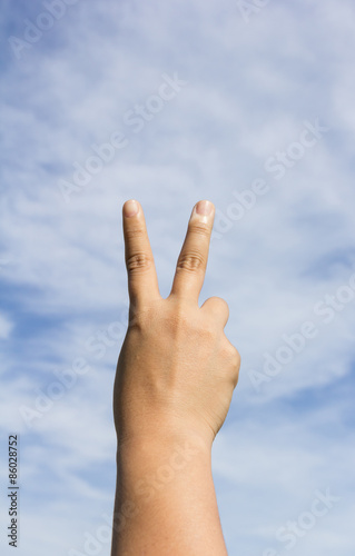 Hand making victory sign