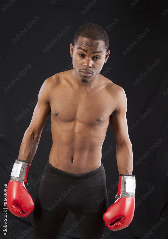Black man with boxing gloves on