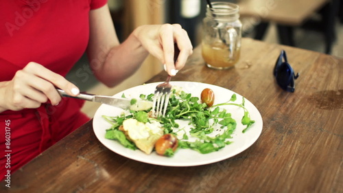 Wallpaper Mural Woman hands eating salad in cafe 
 Torontodigital.ca