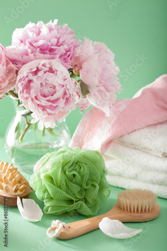 bath and spa with peony flowers brush sponge towels