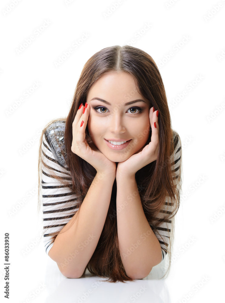Beautiful happy girl lying and looking at camera. Isolated on wh Beautiful happy girl lying and looking at camera. Isolated on wh