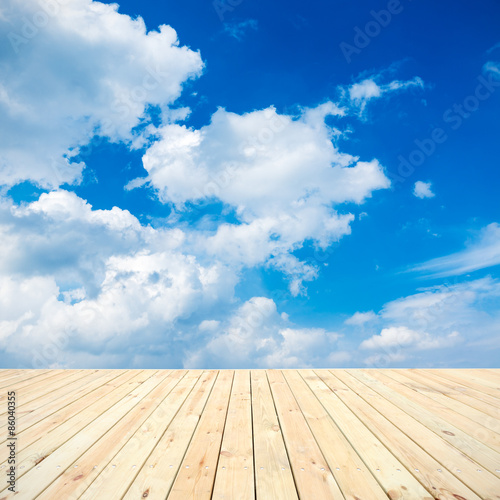 Wood platform in the blue sky