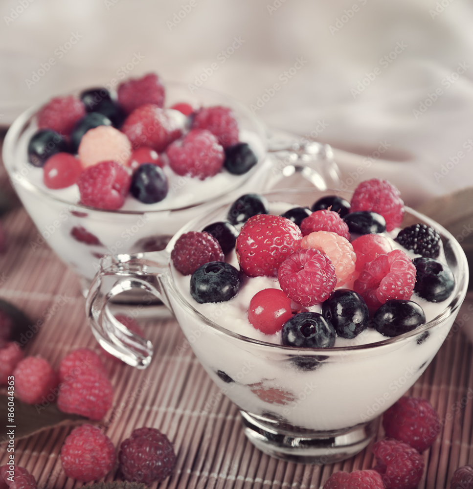 Two Cups Of Yogurt With Berries