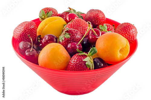 Red bowl with fruits  strawberry  apricots