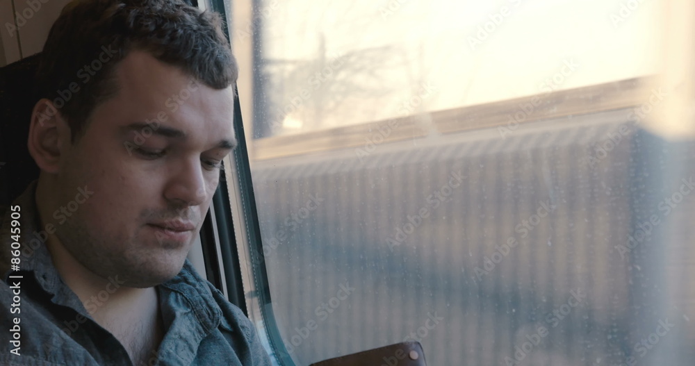 Man checking his wallet in the train