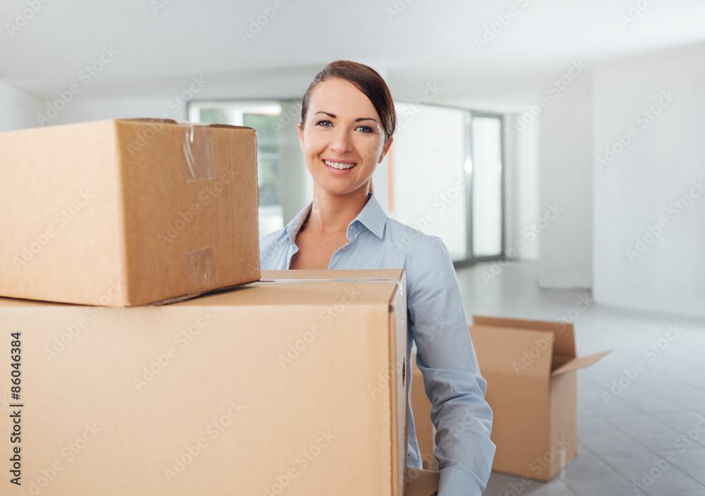 Young woman carrying carton boxes