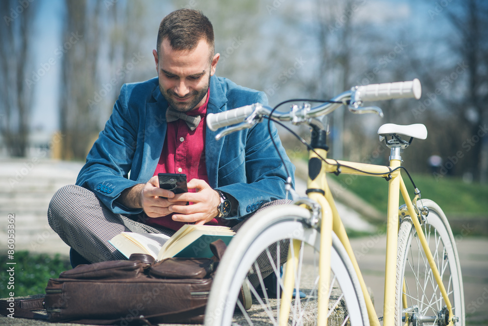 Man on his bike using smart phone