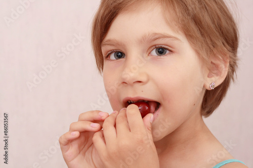 little girl with sweet cherries
