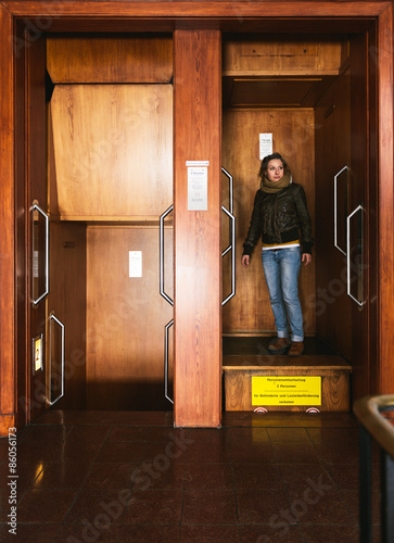 Woman in paternoster elevator
