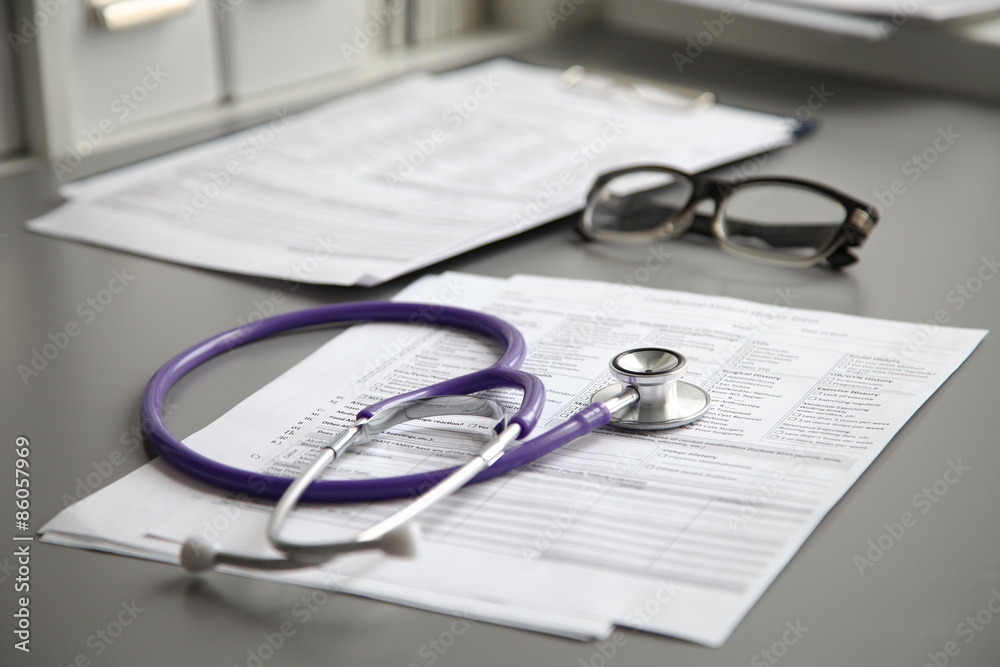 Stethoscope on the grey desk, close up Stethoscope on the grey desk, close up