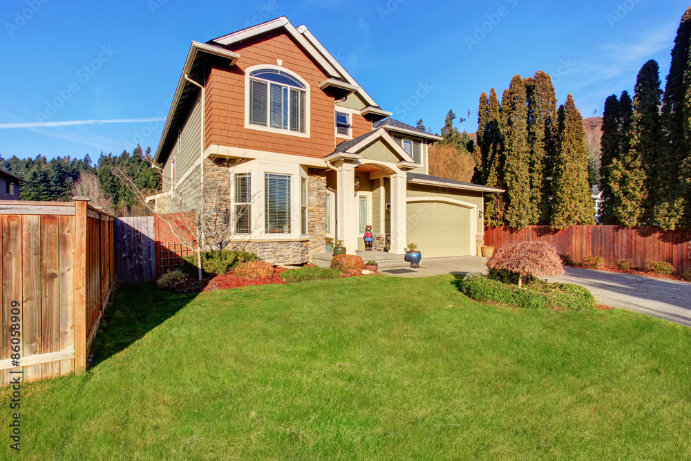 Large modern house with driveway, and garage. Large modern house with driveway, and garage.