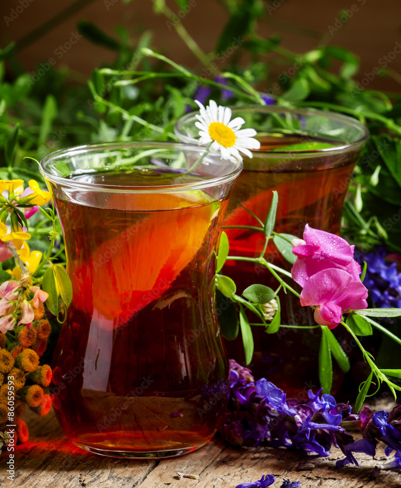 Black tea with lemon and herbs in an authentic Middle Eastern gl Black tea with lemon and herbs in an authentic Middle Eastern gl