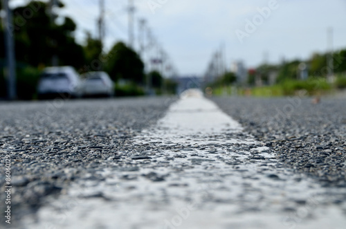 asphalt road with white line on center