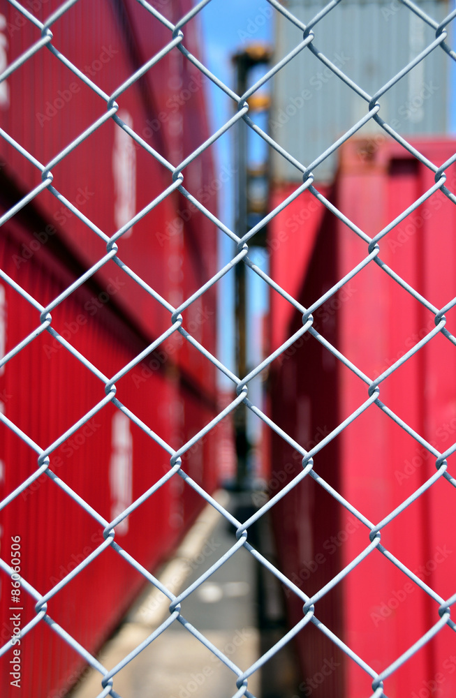 Fototapeta premium Wire mesh fence enclosing the container yard