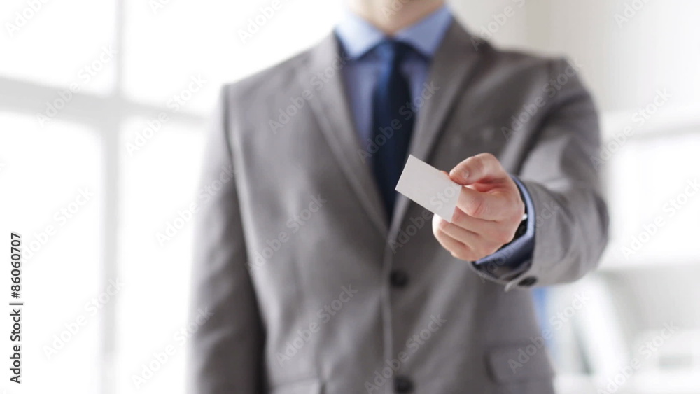 close up of businessman giving white blank card