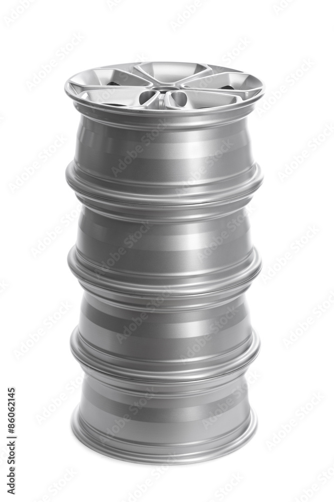 Set in a stack of steel alloy car rims. Set in a stack of steel alloy car rims.