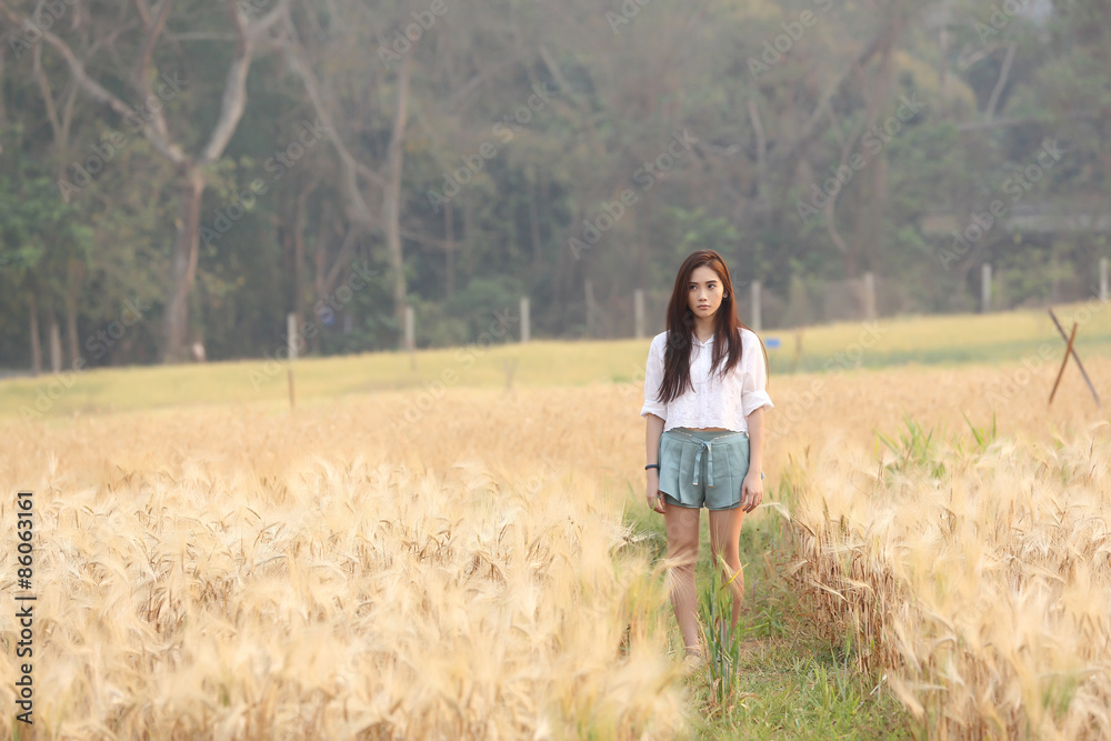 Asian girl on wheat field Asian girl on wheat field