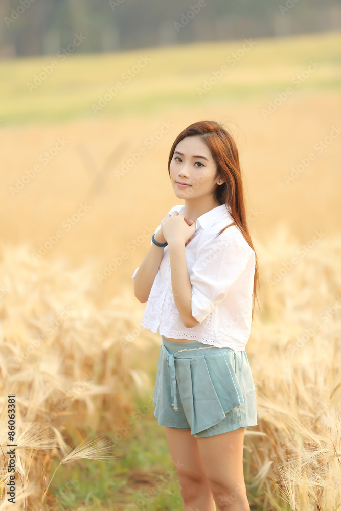 Asian girl on wheat field Asian girl on wheat field