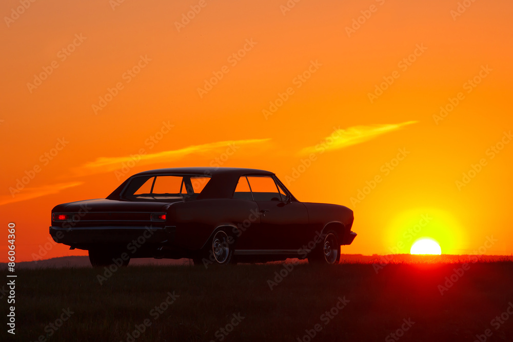 Retro car silhouette on sunset