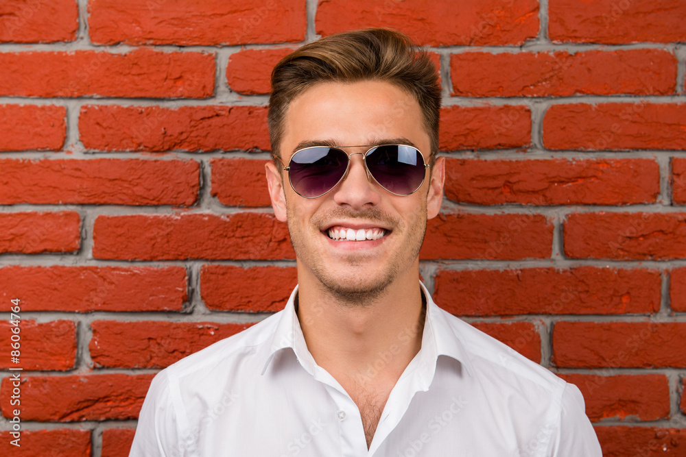 handsome man with his sunglasses handsome man with his sunglasses