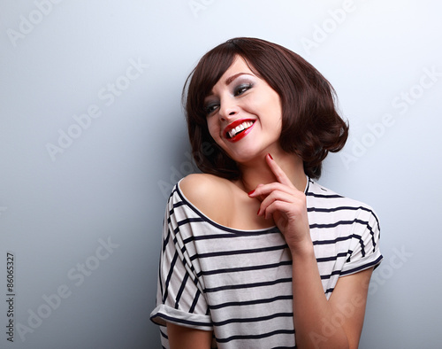 Happy natural laughing young short hairstyle woman in fashion bl