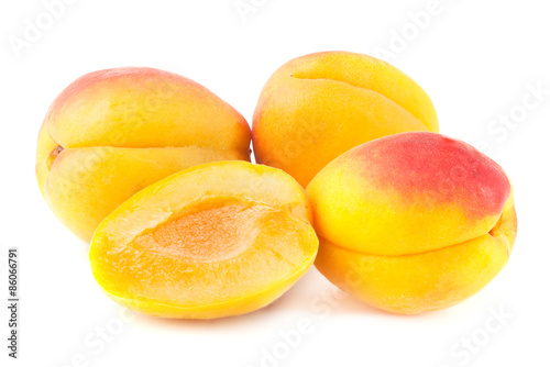 Ripe apricots on white.