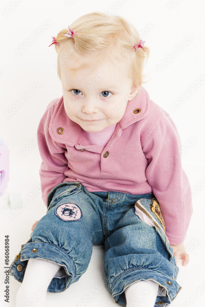 portait of sitting little girl wearing jeans portait of sitting little girl wearing jeans