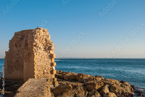 ruins of an ancient fortress in the midst of the sea in Acre in Israel