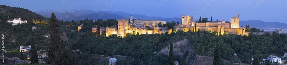 Granada - panorama of Alhambra palace and fortress at dusk.