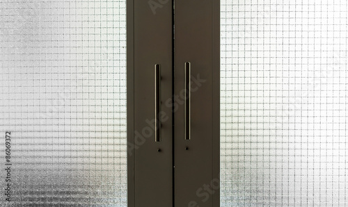 dark green doors with metal handles
