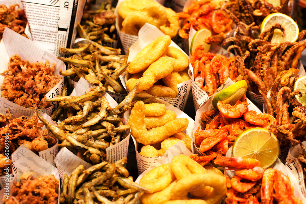 Fish & Chips served in the newspaper on a market stall. Fish and Fish & Chips served in the newspaper on a market stall. Fish and